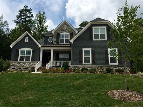 blue house grey metal roof|gray siding black windows.